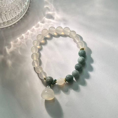 The lotus begets all creation • White jade bracelet