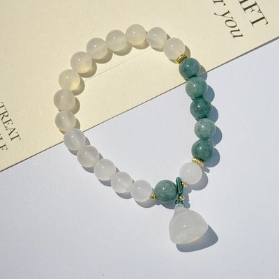 The lotus begets all creation • White jade bracelet