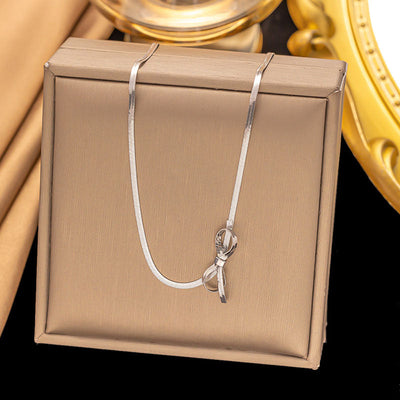 Snake bone chain bow necklace