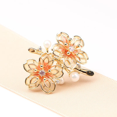 Orange floral brooch