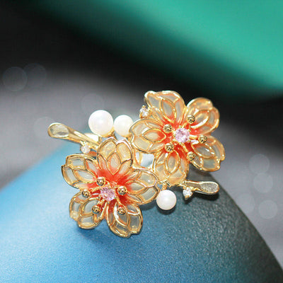 Orange floral brooch