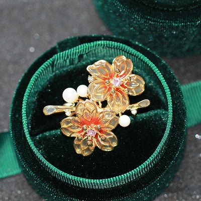 Orange floral brooch