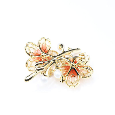 Orange floral brooch