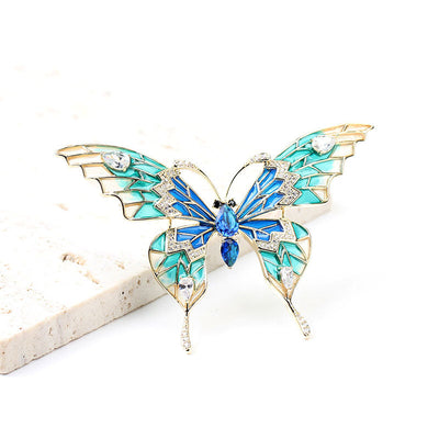 Butterfly red and blue natural crystal brooch