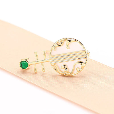 Natural shell musical instrument brooch