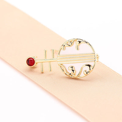 Natural shell musical instrument brooch