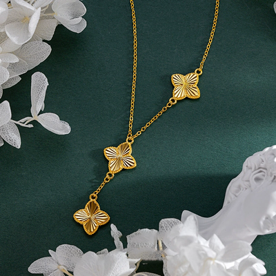 Three flowers and four-leaf clover necklace