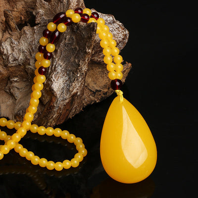 Drop-shaped natural beeswax pendant necklace