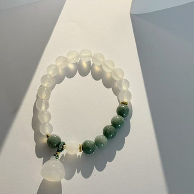 The lotus begets all creation • White jade bracelet
