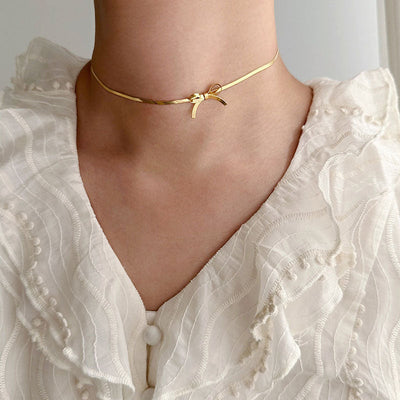 Snake bone chain bow necklace