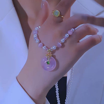 Pink cat's eye stone peace buckle necklace