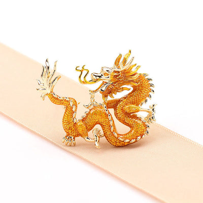 Flying golden dragon brooch
