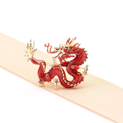 Flying golden dragon brooch