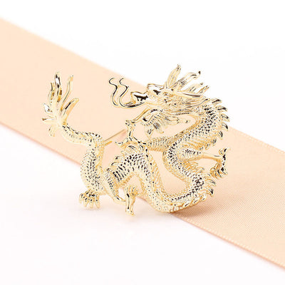 Flying golden dragon brooch