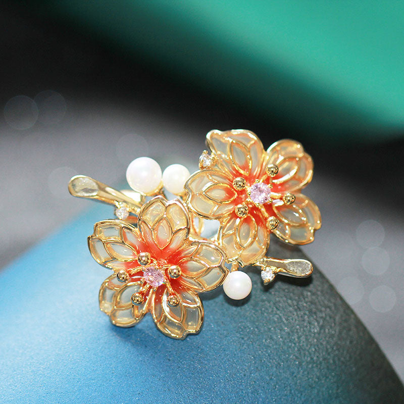 Orange floral brooch