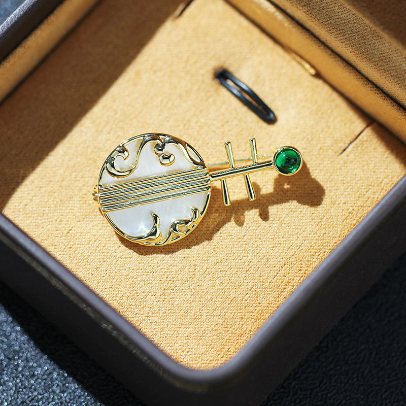 Natural shell musical instrument brooch