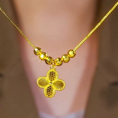 Four-leaf flower gold bead necklace