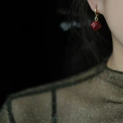Red oil drop ball earrings