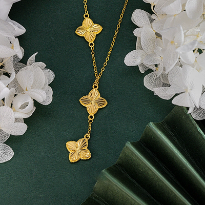 Three flowers and four-leaf clover necklace