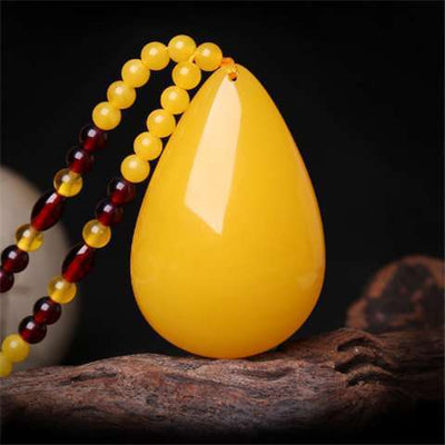 Drop-shaped natural beeswax pendant necklace