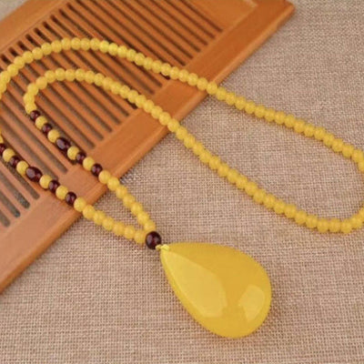 Drop-shaped natural beeswax pendant necklace