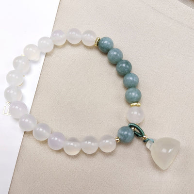 The lotus begets all creation • White jade bracelet